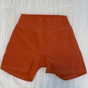 Buff bunny, legacy 4 inch shorts in burnt orange color